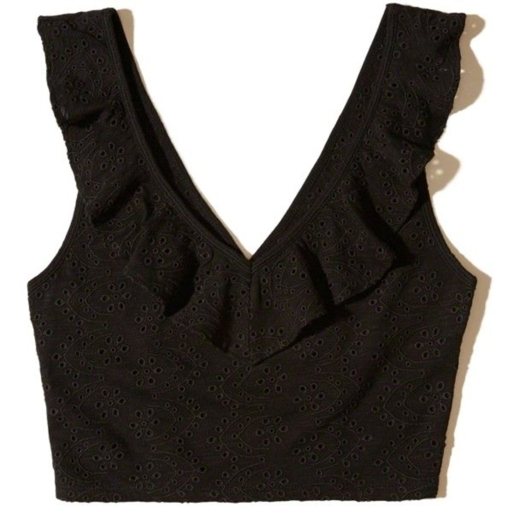 NWOT eyelet lace pattern ruffle front crop top
